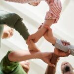 Low Angle View of Five People Holding Hands